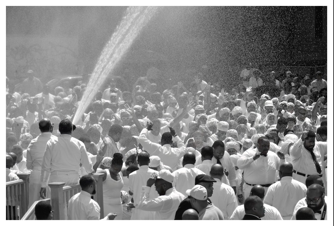 Lisa Dubois, Baptizing the Community –Baptized by Firehose, 2021. Black-and-white giclée print. 11 x 14 in.