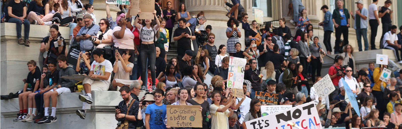 A large group of young people at a climate action protest
