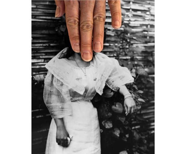 An video still from a work by the artist Stephanie Syjuco showing a black-and-white archival photograph of a woman dressed in white with the fingers of a hand  on top of the photograph covering the face of the figure.