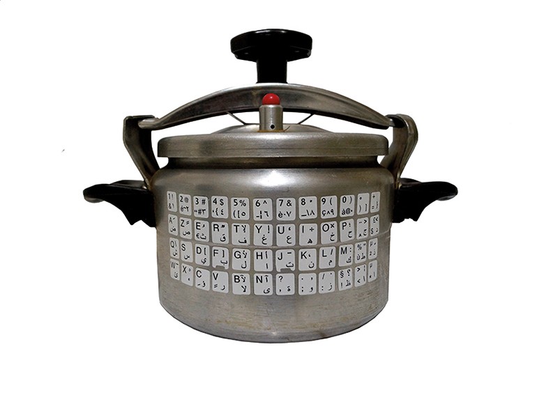 Adel Bentounsi. "CV," 2019. Pressure cooker with keyboard stickers for PC. Courtesy of the artist. Sculpture by Adel Bentounsi titled "CV" comprised of a stainless steel pressure cooker with bilingual (Latin/Arabic) computer keyboard stickers.