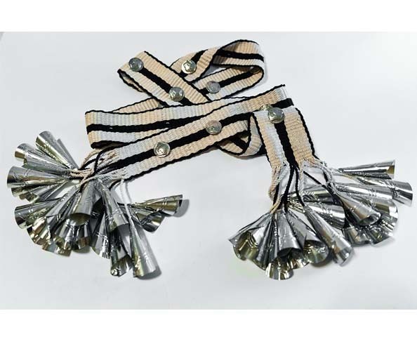 Dakota Mace, Sis Lichii’í (Diné Sash Belt), 2021. Cotton, wool, silver, aluminum cones (silverwork by Joe Mace); 2 x 71 in.