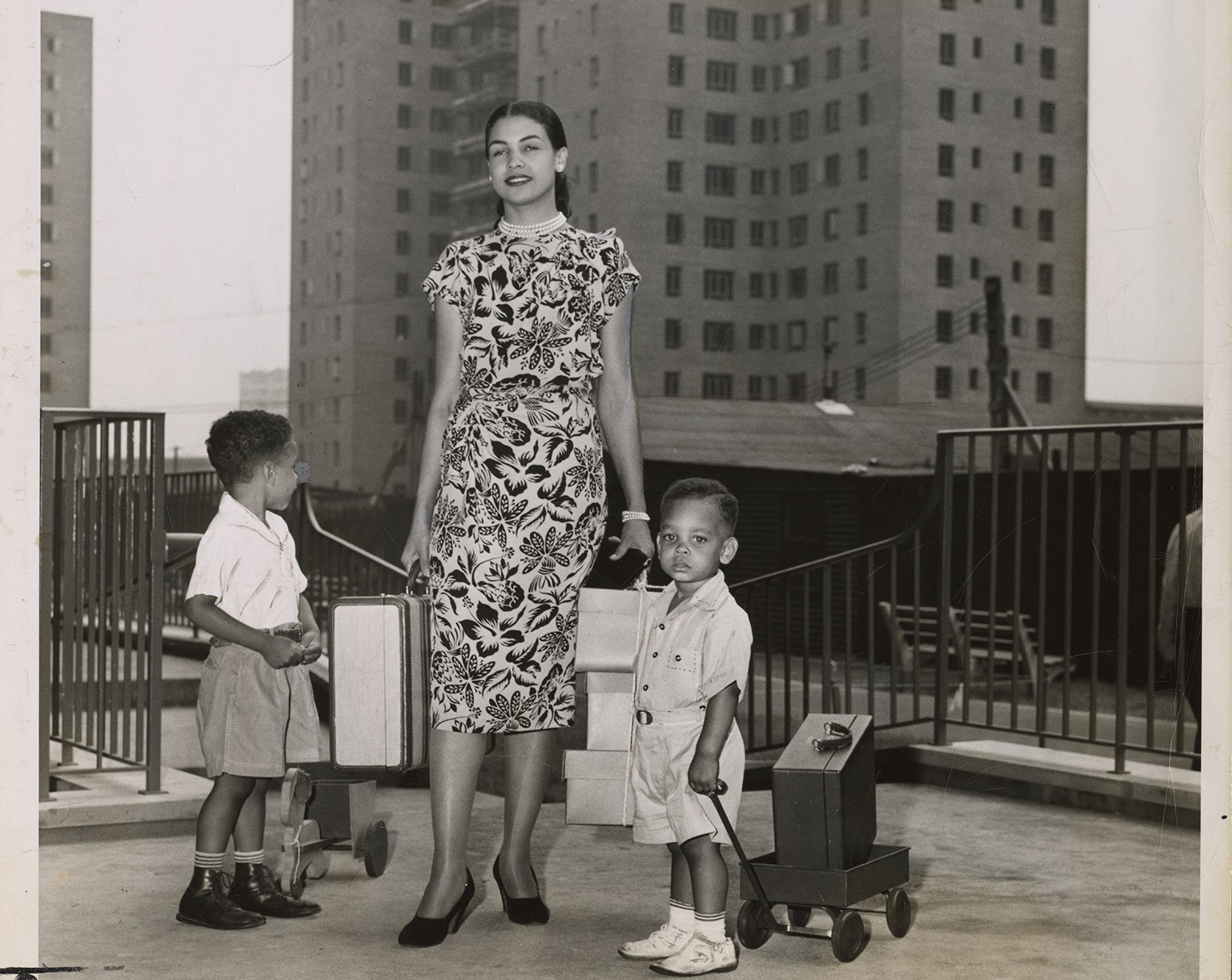 Mattie Faulkner and her children moving in, Riverton Houses, July 29, 1947, Photographs & Prints Division, Schomburg Center for Research in Black Culture, New York Public Library