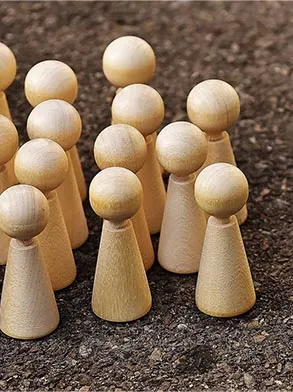 wooden game pieces resembling a crowd of people