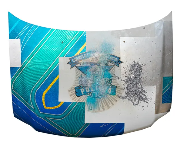 Rubén Ortiz-Torres, Chota, Cholos, and Narcos, 2020. Silverleaf, urethane, lead, candy paint, and flake on decommissioned Tijuana Police car panel, 48 x 62 x 5 inches.
