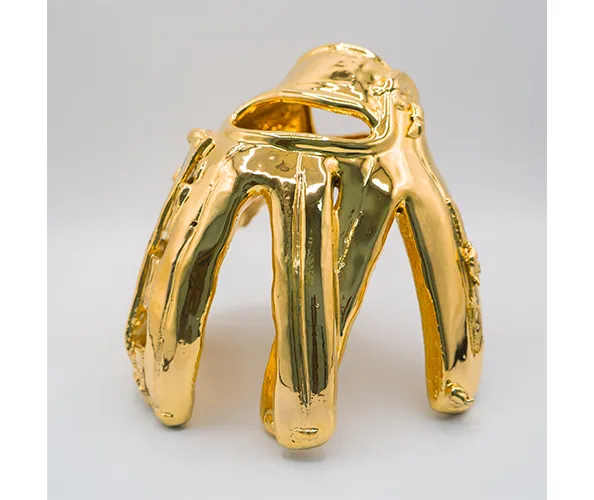 Rubén Ortiz-Torres, Gold Glove, 2024. Gold-glazed stoneware, 19.6 x 23.1 x 20.2 cm, Cerámica Suro, Taller Nodo, Guadalajara.
