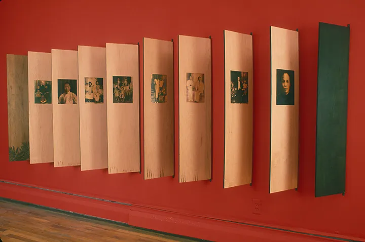 Tomie Arai, installation photo of "Stories from La Colonia China," 2003. Wood, silkscreen, and metal hinges. 4 x 15 feet, dimensions variable.