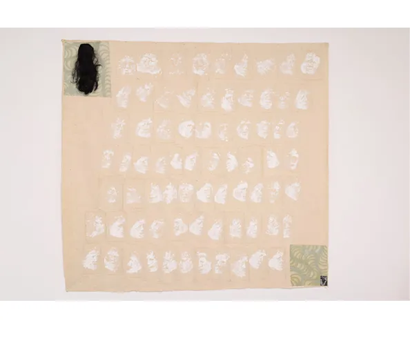 Carlos Villa, Untitled (Face Print with Wig and Photograph), c. 1979. Acrylic on canvas with collaged canvas elements, wig and photograph; 97 x 107 in. © Estate of Carlos Villa; courtesy Anglim Trimble, San Francisco, CA.