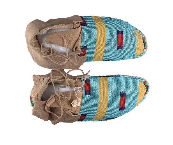 Unknown Crow/Apsáaooke, Wedding Moccasins, 20th c. Rawhide, beads; each 4 x 10 x 4 3/4 in. Avery Architectural & Fine Arts Library, Collection of Art Properties.